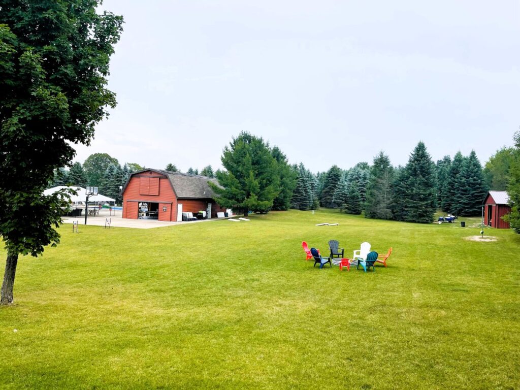 Starlight RV Resort Lawn with firepit and recreation building